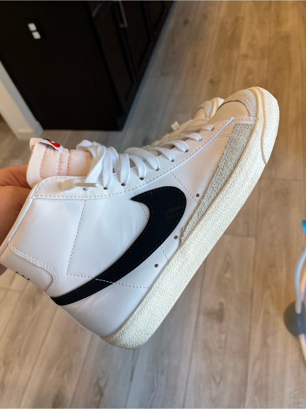 Nike White High-Top Sneakers with Black Swoosh